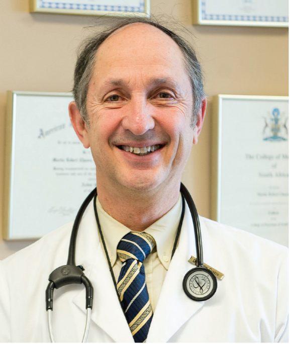 Headshot of Dr. Martin Chasen in lab coat.